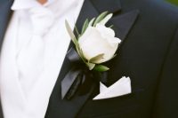 an elegant modern white rose and greeneyr boutonniere with a black bow tie is a stylish idea to spruce up a classic tux and make it cooler