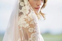 an embroidered cathedral veil with a floral lace edge is a gorgeous solution for a chic and refined bridal look