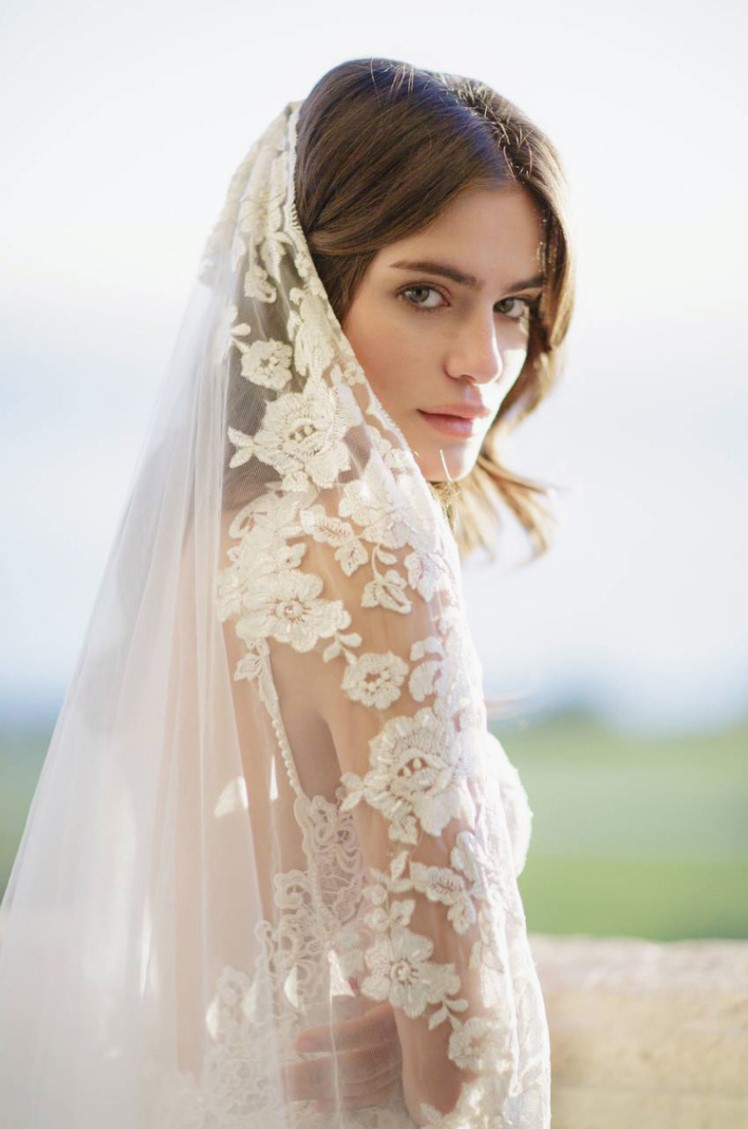 an embroidered cathedral veil with a floral lace edge is a gorgeous solution for a chic and refined bridal look