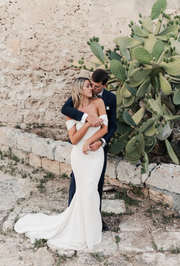 an off the shoulder mermaid wedding dress with a train is a gorgeous and sexy idea for a classic bridal look