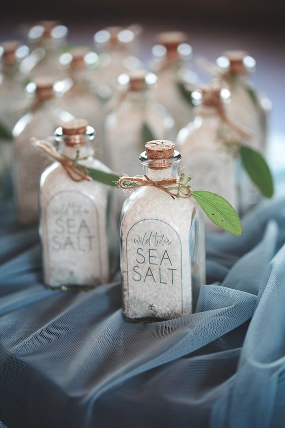 bottles with sea salt decorated with greenery will fit not only beach weddings but coastal spring too