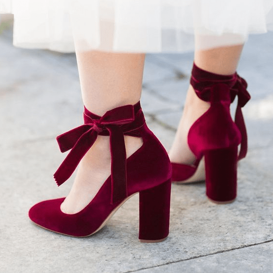 burgundy velvet shoes with ties and bows on the ankles look amazingly girlish and very chic
