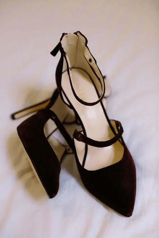 burgundy velvet strappy shoes with high heels are a very beautiful and deep-toned idea for a modern Halloween bridal look with a refined touch