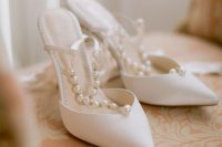 chic classic white wedding shoes with ankle straps and pearls are amazing to finish off a bridal look with classic touches