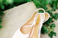 chic white wedding slingbacks with embellished backs are very trendy and will be perfect for a modern or minimalist bride