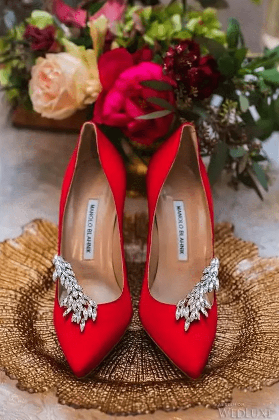 extra bold red wedding shoes with heavy embellishments are a gorgeous idea for a Christmas, fall, Halloween or just winter wedding