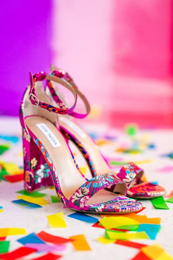 hot pink wedding heels with colorful floral embeoidery are amazing for a bold and catchy bridal look