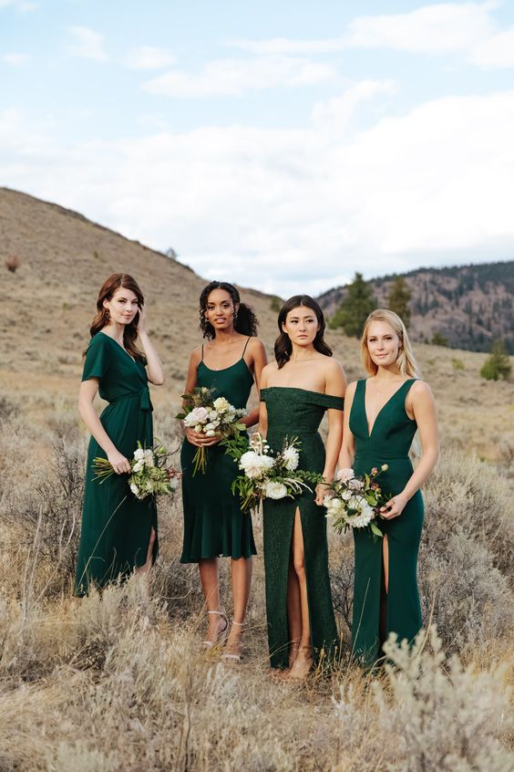 lovely mismatching hunter green bridesmaid dresses and pretty white and green bouquets are adorable and chic