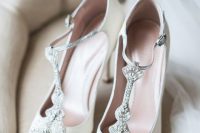 lovely white wedding shoes with embellished T straps will make yoru bridal look very refined and very chic
