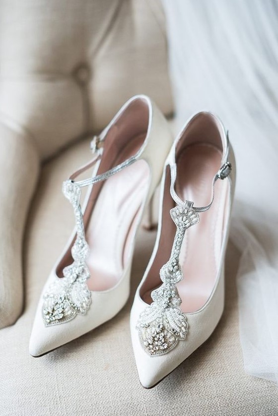 lovely white wedding shoes with embellished T straps will make yoru bridal look very refined and very chic