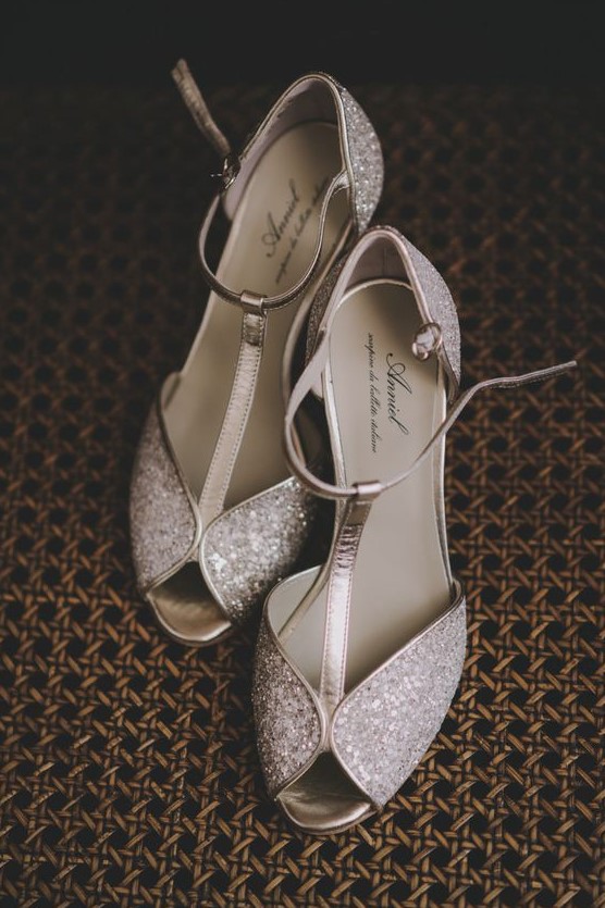 romantic glam silver glitter wedding shoes with metallic touches and peep toes add a bling to the look
