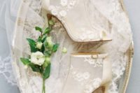 sheer wedding booties with peep toes, buckles and floral appliques and beads are fashion-forward