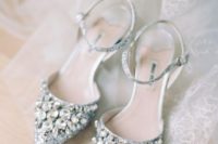 super shiny silver heavily embellished wedding shoes with ankle straps are a super glam idea
