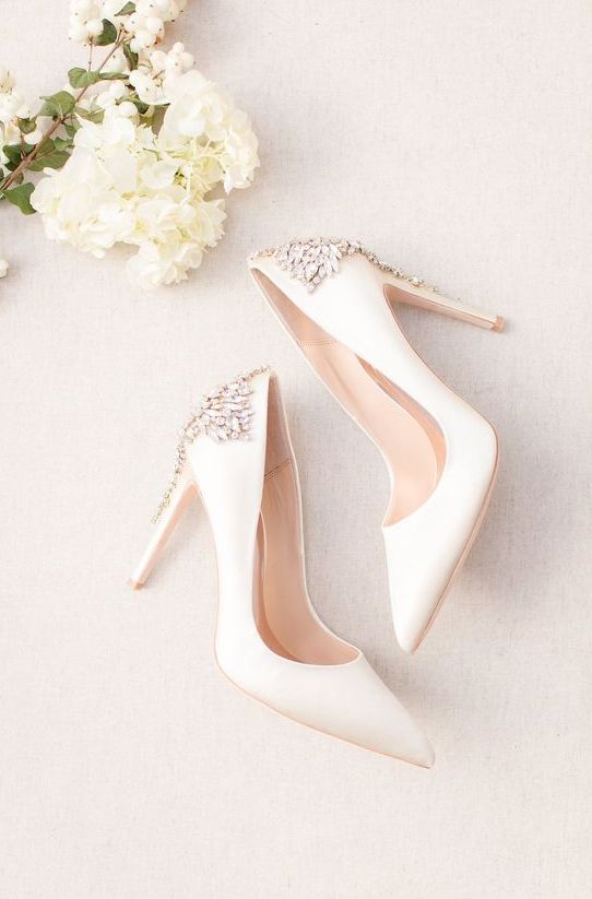 white wedding shoes with heavily embellished backs and heeels by Badgley Mischka are amazing for weddings