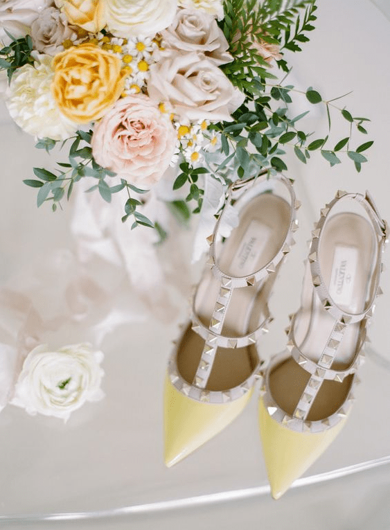 yellow spiked Valentino pointed toe heels for a bold color statement at a spring or summer wedding