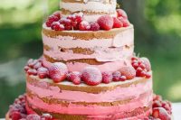 02 a beautiful red and pink naked wedding cake topped with strawberries and raspberries is a gorgeous idea for a boho summer wedding
