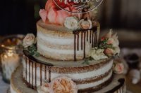 06 a delicious three-tier naked wedding cake with chocolate drip, neutral and pastel blooms and a mountain topper