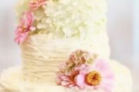 110 a white ruffle wedding cake topped with white and pink blooms is a beautiful and chic idea for a spring or summer wedding