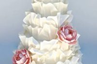 111 a white ruffle wedding cake with pink sugar blooms is a very creative and fun idea for a spring or summer wedding