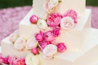 112 a white square wedding cake with pink and blush cascading blooms is a beautiful option for summer