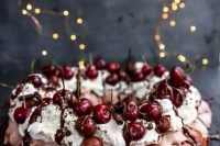 129 a blush pavlova wreath topped with whipped cream, chocolate drip, chocolate sticks and cherries is a lovely idea for a summer or fall wedding