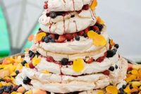 134 a fantastic pavlova wedding cake with bright petals on top, bold fresh berries is a gorgeous and fun idea for a summer wedding