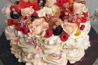 136 a gorgeous pavlova wedding cake topped with pink and blush blooms, with fresh berries and pink glitter is amazing for a summer wedding