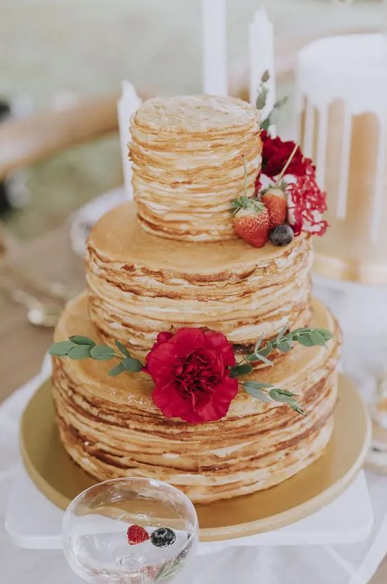 a pancake wedding cake with cream cheese, fresh berries and a bold red bloom is a fantastic idea for a summer wedding