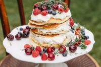 141 a pancake wedding cake with whipped cream, fresh berries and herbs is a gorgeous idea for a summer wedding