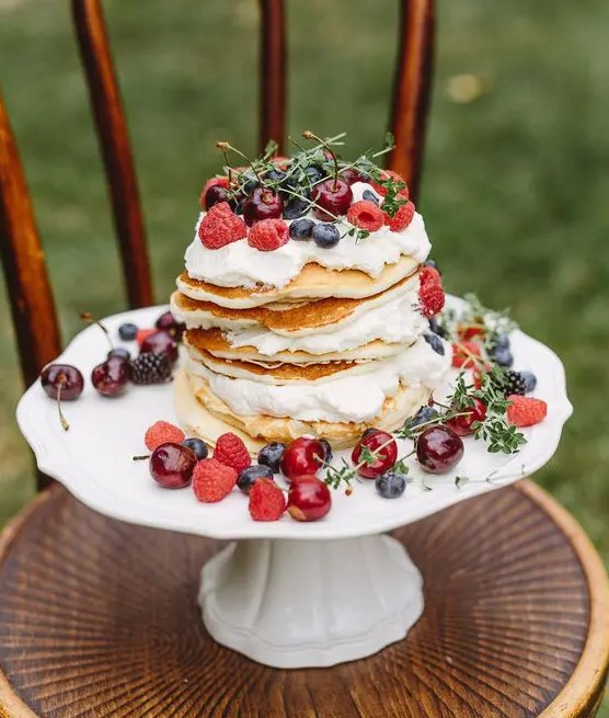 a pancake wedding cake with whipped cream, fresh berries and herbs is a gorgeous idea for a summer wedding