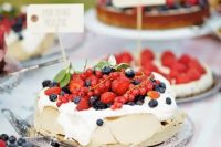 144 a pavlova wedding cake topped with cream and fresh berries is a great alternative to a usual wedding cake, it looks yummy and cool