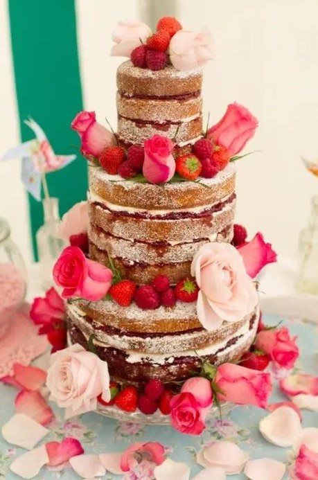 a naked wedding cake with berry drip, fresh berries and pink and hot pink blooms is a fantastic idea for a bold summer wedding