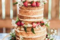 22 a naked wedding cake topped with fresh strawberries and white blooms and greenery is a cool rustic summer wedding piece