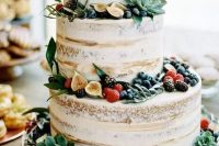29 a yummy naked wedding cake topped with berries, greenery, fruits and succulents is a lovely idea for a spring or summer wedding