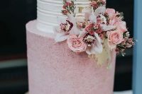 33 a beautiful and chic wedding cake with a white striped tier, a pink polka dot one, pink and white blooms and greenery is wow