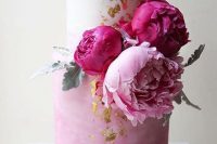 37 a beautiful white and watercolor pink wedding cake with gold leaf and bold pink and light pink peonies is a gorgeous idea for summer