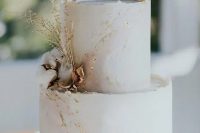 38 a blush marble textural wedding cake with gold leaf, dried blooms and herbs is a very refined idea for a delicate and formal summer wedding