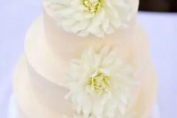 39 a blush wedding cake decorated with white blooms is a tender and sweet idea for both a spring or a summer wedding
