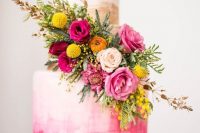 41 a bold pink watercolor wedding cake with brushstrokes, gold brushstrokes, bold pink, yellow and orange blooms and greenery