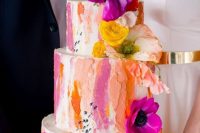 42 a bold wedding cake with colorful dimensional brushstrokes plus bold flowers and greenery is a vivacious idea to rock