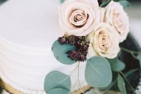 51 a buttercream-frosted wedding cake with roses and greenery is a very elegant and chic idea