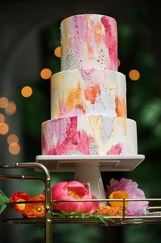 a colorful textural wedding cake in pink, coral, yellow and orange plus gold splashes is very chic idea for a colorful summer wedding