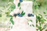 64 a heavenly secret garden wedding cake with sugar floral detailing, fresh berries and some foliage is a delicate and refined idea