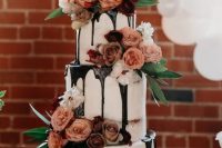67 a jaw-dropping three-tier wedding cake with chocolate drip, mauve and peachy blooms, greenery is a chic idea for any wedding