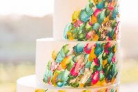68 a jaw-dropping wedding cake with colorful brushstrokes and bold blooms on top is a very cool idea