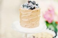 74 a neutral textural buttercream wedding cake topped with sugared berries is a fantastic idea for a summer wedding, it looks delicious