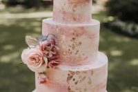 76 a pink marble wedding cake with gold foil, pink and blush blooms, some greenery is always a good idea for a spring or summer wedding