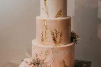 77 a pink marble wedding cake with gold leaf, frehs blush blooms and greenery and a calligraphy topper looks refined and very romantic at the same time