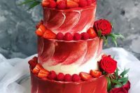 82 a red and white textural wedding cake topped with red roses and greenery and strawberries and rapsberries is a gorgeous idea for a modern wedding