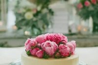 90 a stylish buttercream one tier wedding cake topped with bright pink peonies is a chic idea for a modern wedding